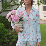Video of woman outside wearing long sleeve  pajamas and pants in Peony on Breeze print. ::: Model is 5'10" wearing size XS /// 