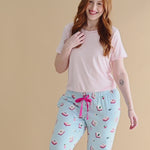 Woman modeling a lounge pant with mahjong tile pattern and light pink tshirt ::: Model is 5'7" wearing size M ///