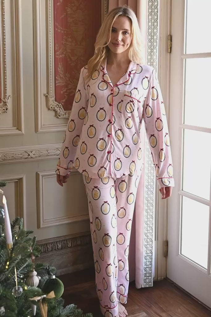 Video of a woman smiling indoors modeling long sleeve pajama set in princess
::: Model is 5'9" wearing size XS ///