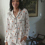 Model wearing cream long sleeve pajama set with halloween teddy bear pattern ::: Model is 5'10" wearing size S ///