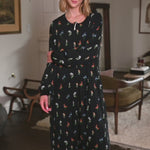 Woman modeling a black sleep sack with long sleeves and a wildflower pattern ::: Model is 5'10" wearing size S/M ///