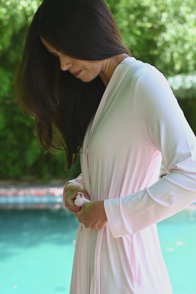 Video of woman modeling a light pink lounge robe by a pool ::: Model is 5'10" wearing size XS/S ///