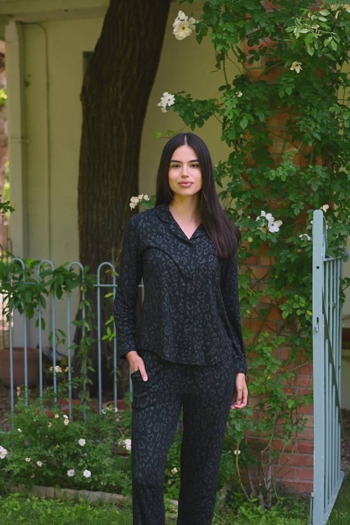 Video of woman modeling Long-Sleeved Women's Pajama Set in Midnight Leopard outdoors  
