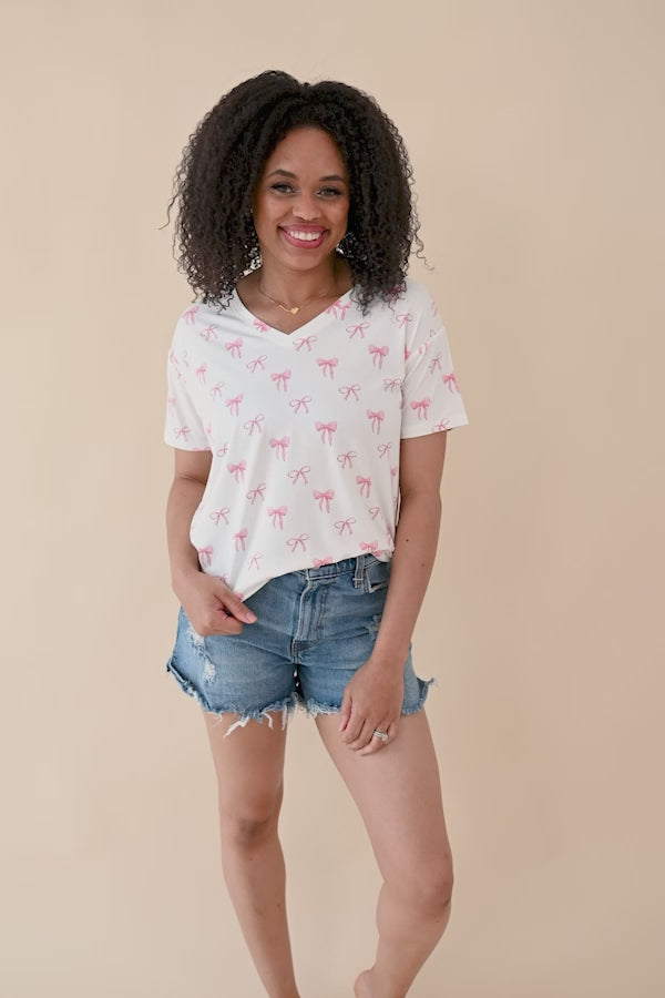 Video of woman modeling  Women’s Relaxed Fit V-Neck in Bow