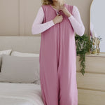 Woman modeling a deep pink sleep sack in a bedroom ::: Model is 5'9" wearing size S/M ///