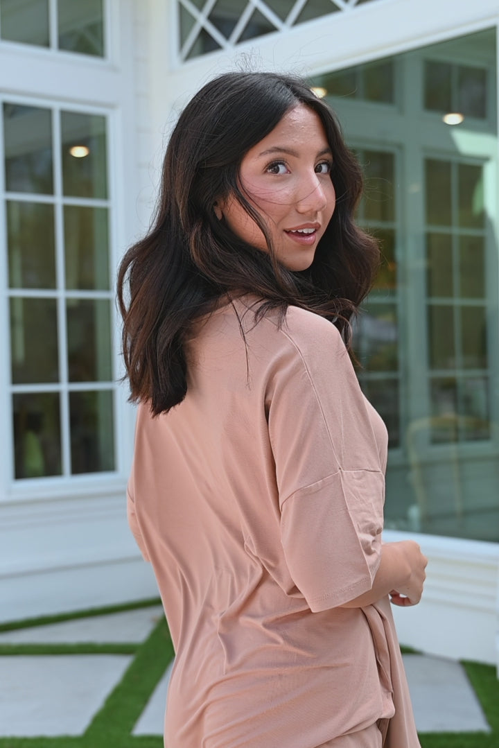 Video of model in light brown biker short set 