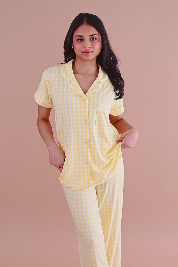 Woman modeling yellow gingham short sleeve cropped pajama set ::: Model is 5' wearing size XS ///