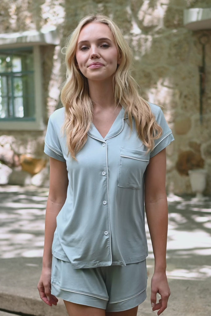 Video of woman modeling a short sleeve light blue pajama set with white piping ::: Model is 5'9" wearing size XS ///