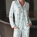 Woman modeling a light green long sleeve pajama set with mahjong tile print ::: Model is 5'10" wearing size XS ///