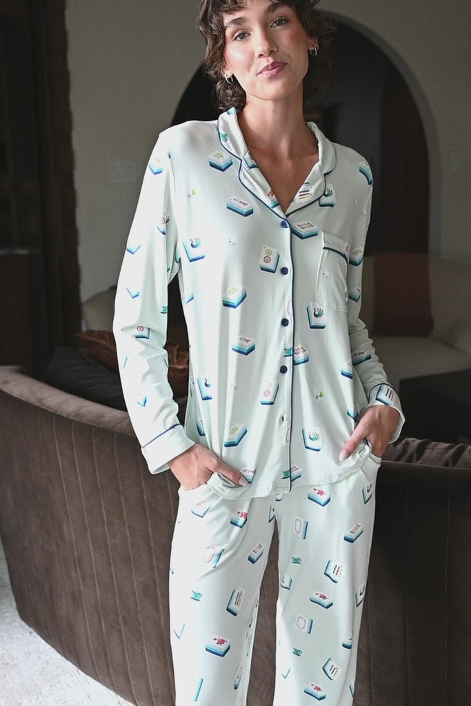 Woman modeling a light green long sleeve pajama set with mahjong tile print ::: Model is 5'10" wearing size XS ///