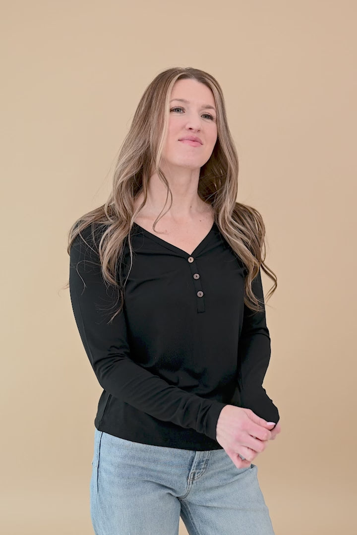 Video of woman modeling Women's Long Sleeve Henley Tee in Midnight