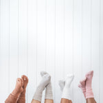 Models wearing Scrunch Socks in Latte, Oat, Cloud and Blush