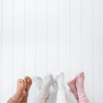 Models wearing the Kyte Scrunch Socks in Latte, Oat, Cloud and Blush