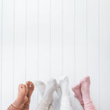 Models wearing the Kyte Scrunch Socks in Latte, Oat, Cloud and Blush
