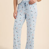 Light blue lounge pants with duck pattern worn by a person on a beige background   ::: Model is 5'2" wearing size M ///