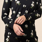 Close up of black magnolia printed top 