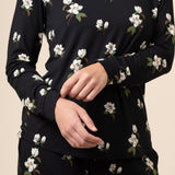 Close up of black magnolia printed top 