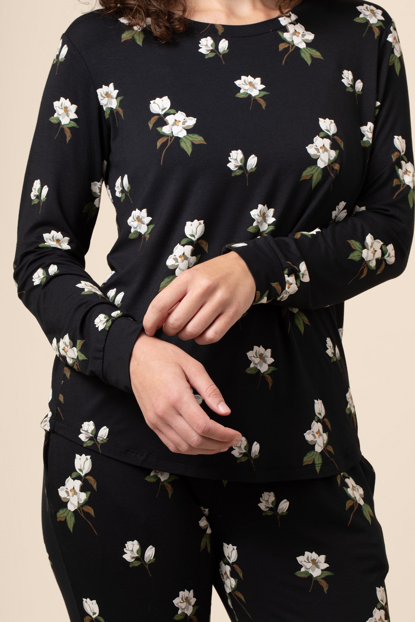 Close up of black magnolia printed top 