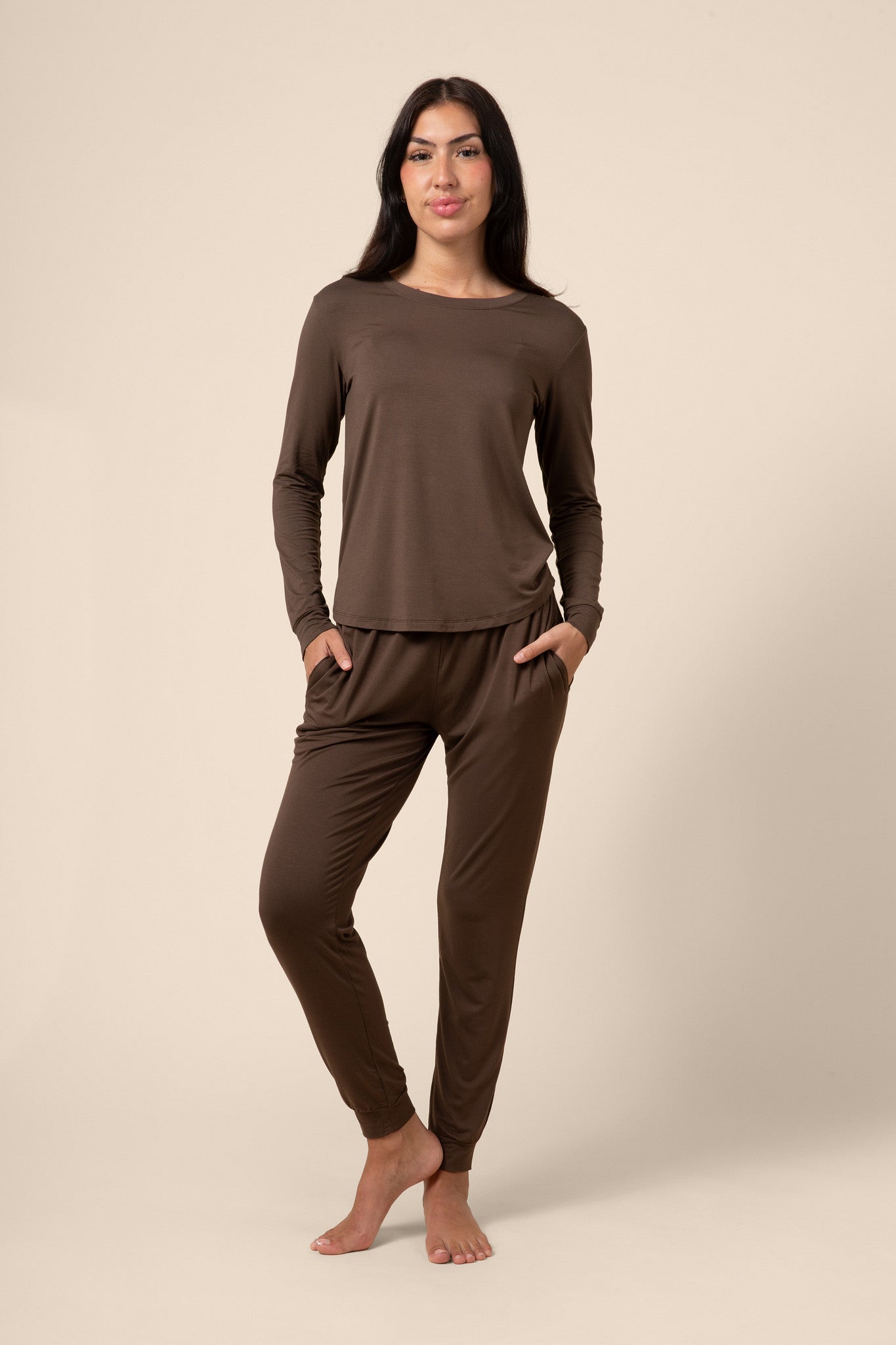 Woman wearing a dark brown jogger pajama set 