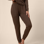 Woman wearing dark brown jogger bottom 