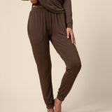 Woman wearing dark brown jogger bottom 