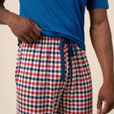 Close up of the  drawstring and waistband on the Men's Lounge Pants in Patriotic Gingham while being worn by a model 